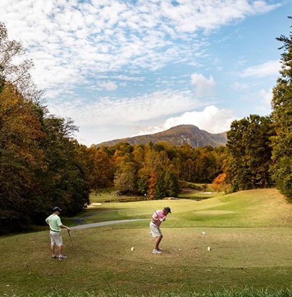 Golfers playing a championship course at Rumbling Bald in Lake Lure